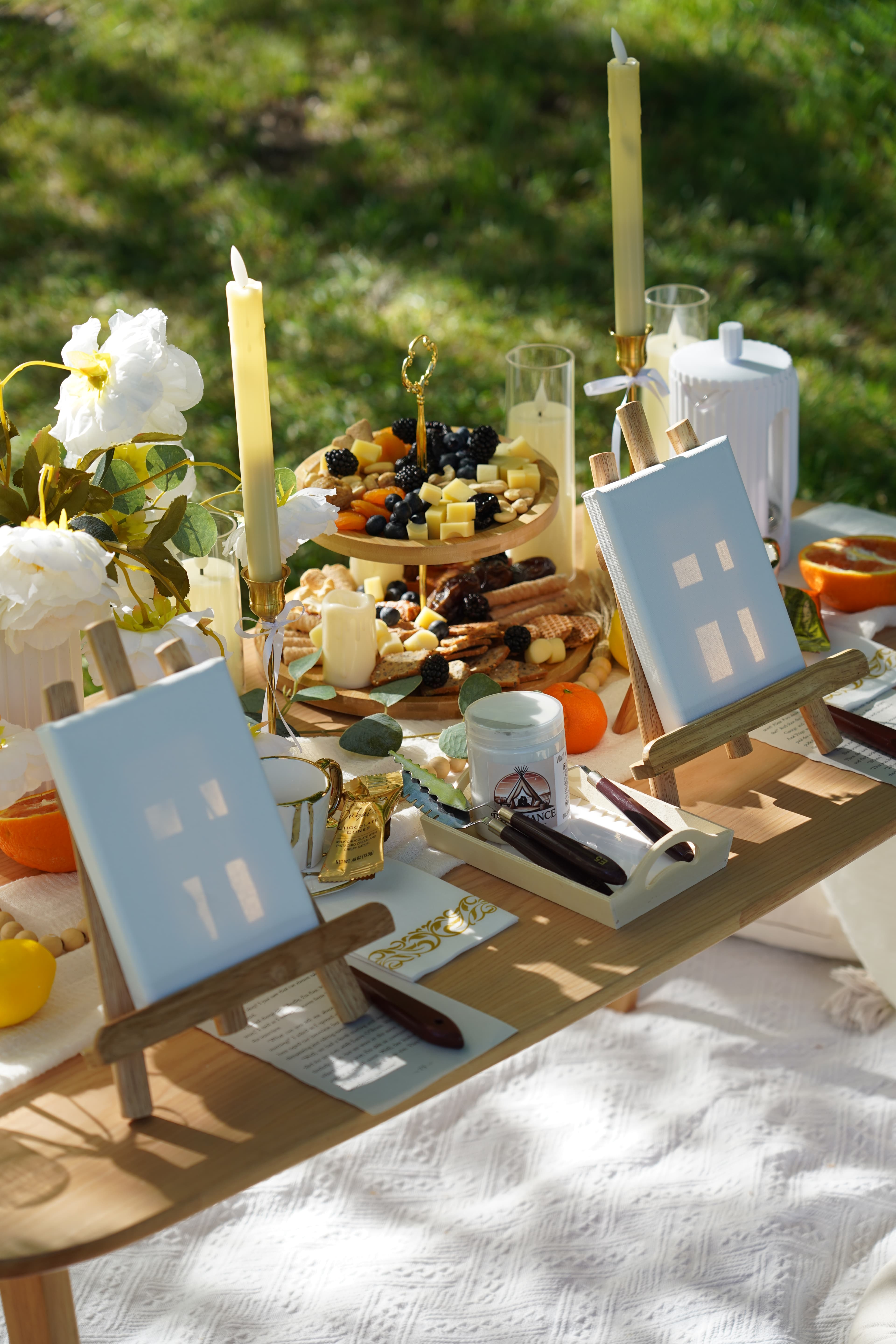 Picnic food spread with flowers and candles in Austin Texas
