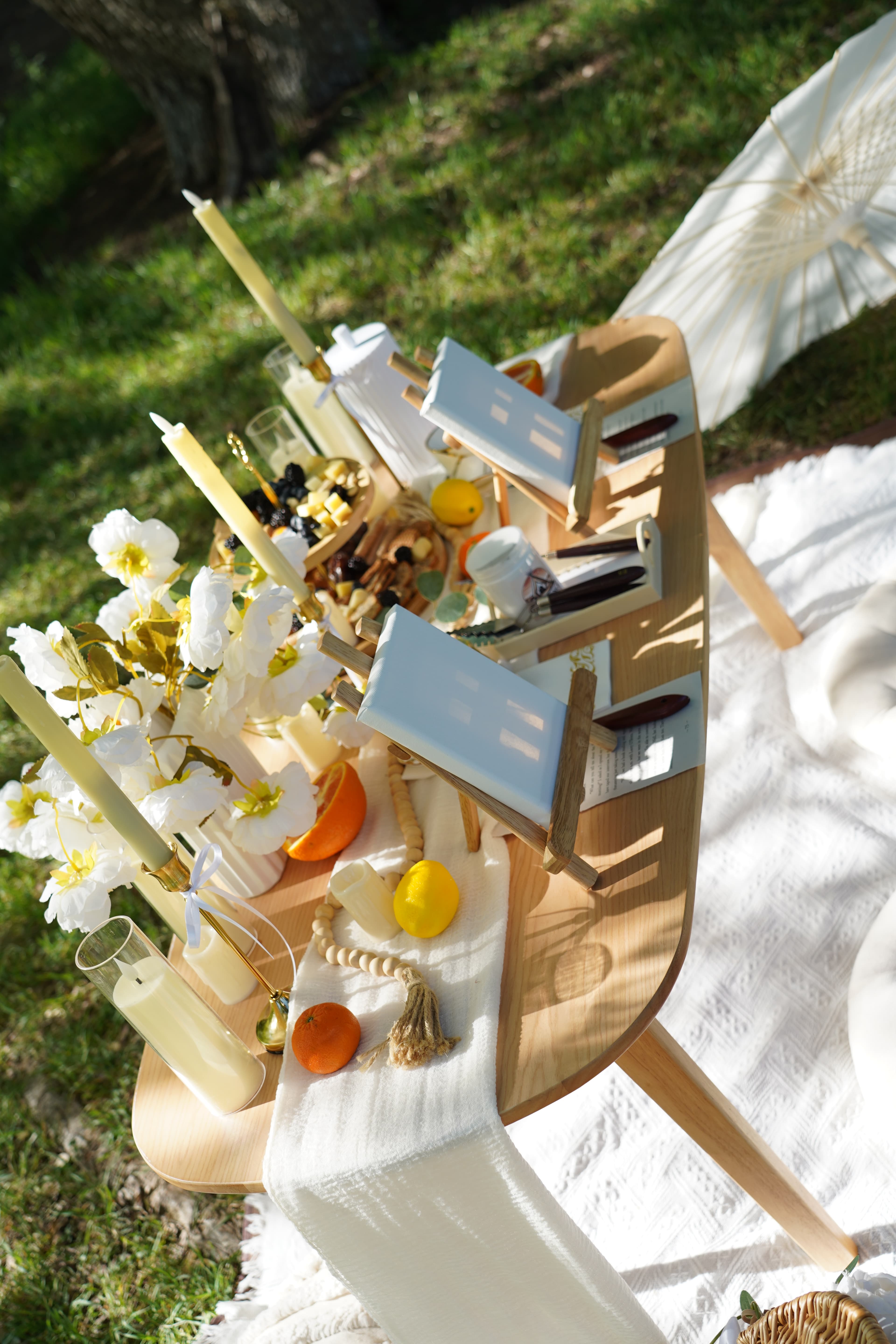 Picnic table detail with food and florals in Austin Texas