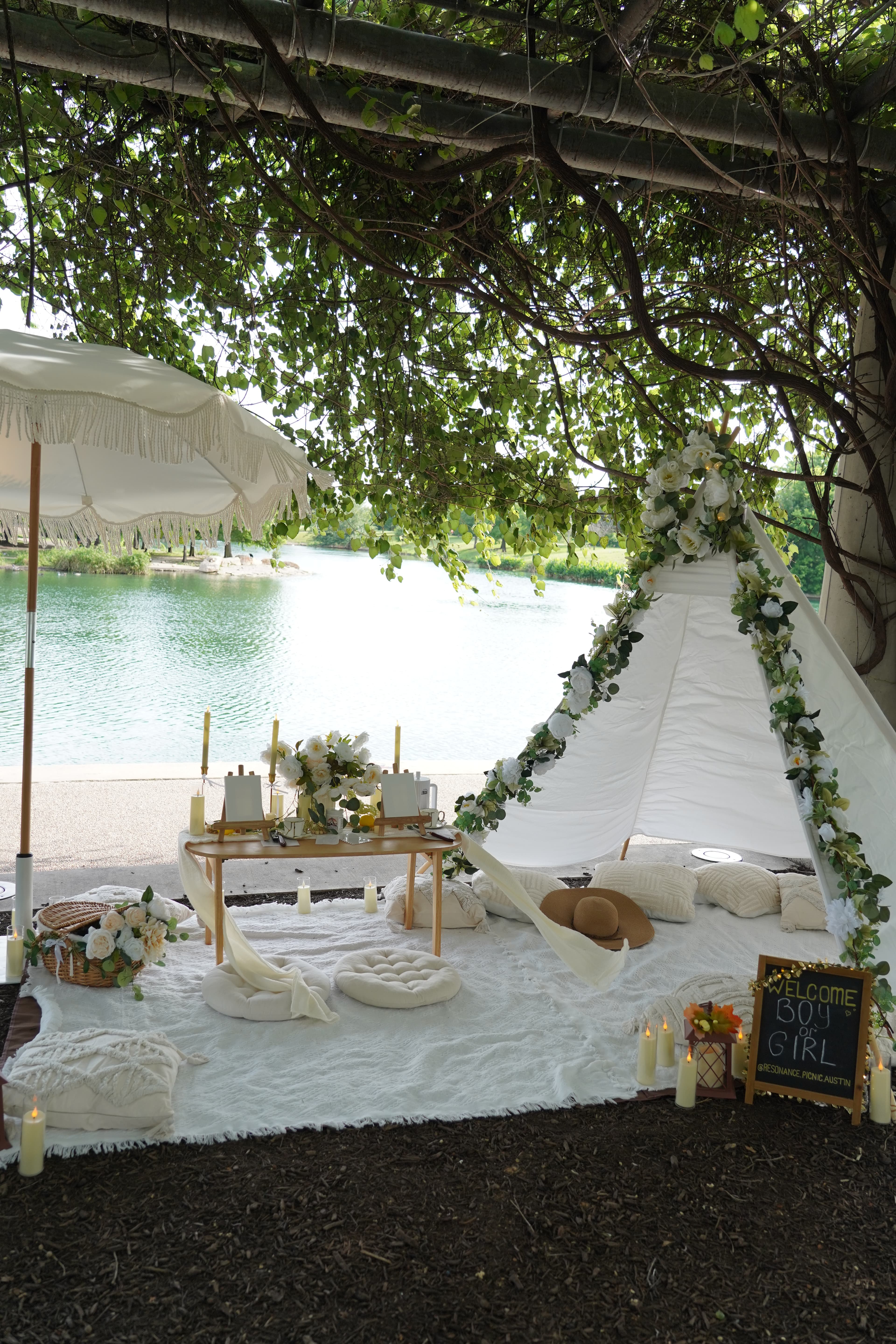 Group picnic setup with white decor by the lake in Austin