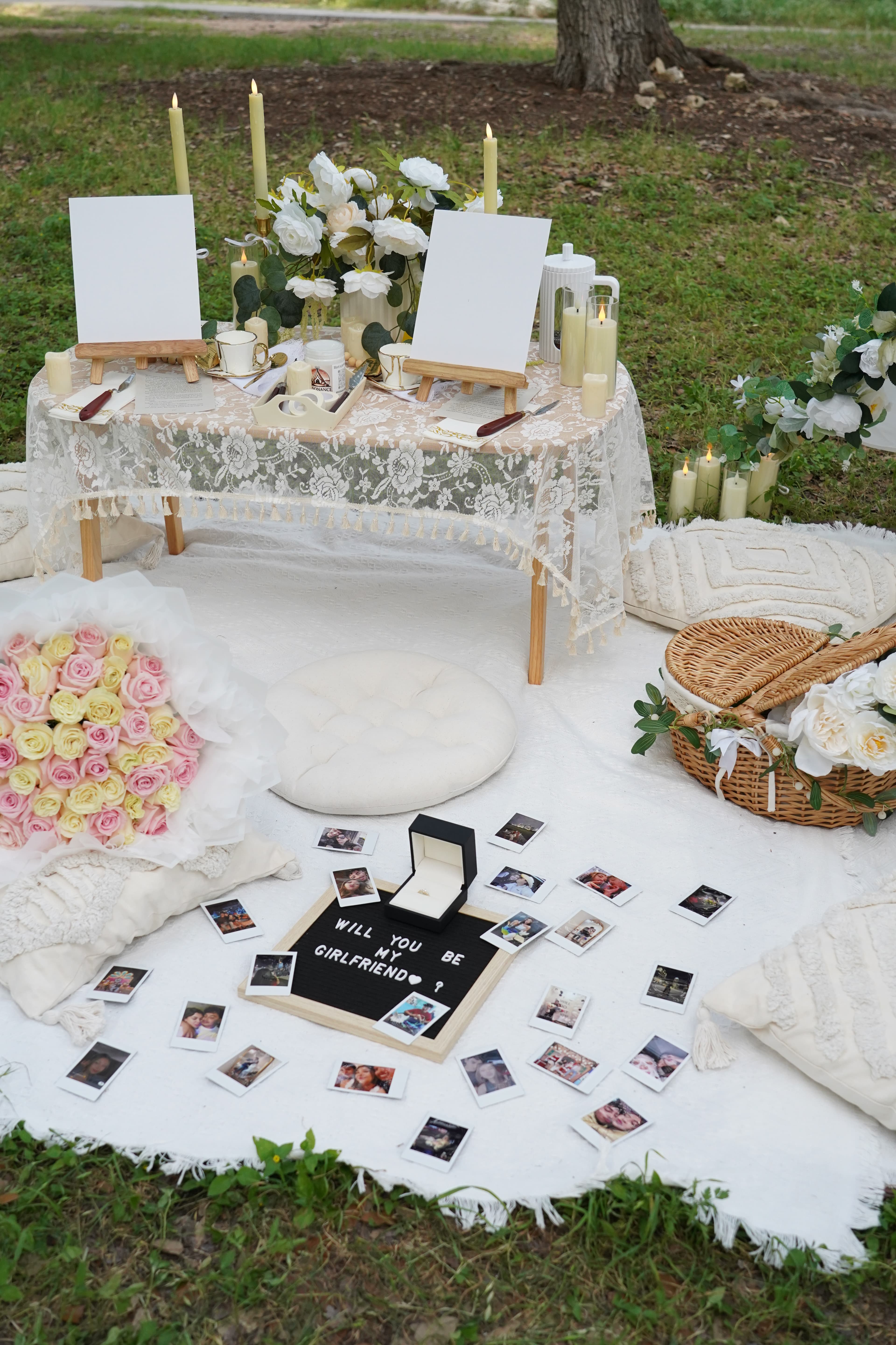 Romantic proposal picnic setup with polaroids and roses Austin