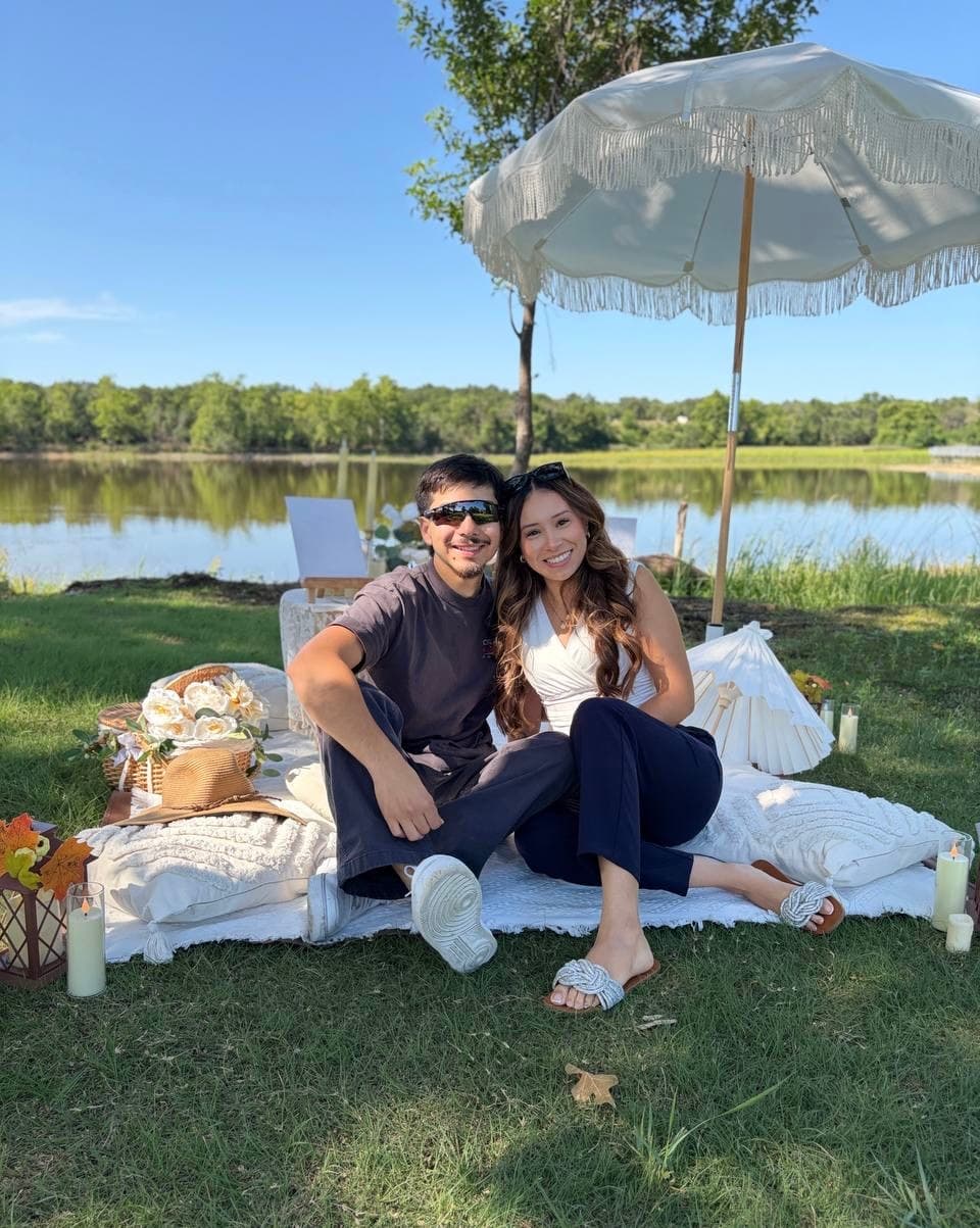 Couple at a luxury picnic by the lake in Austin Texas