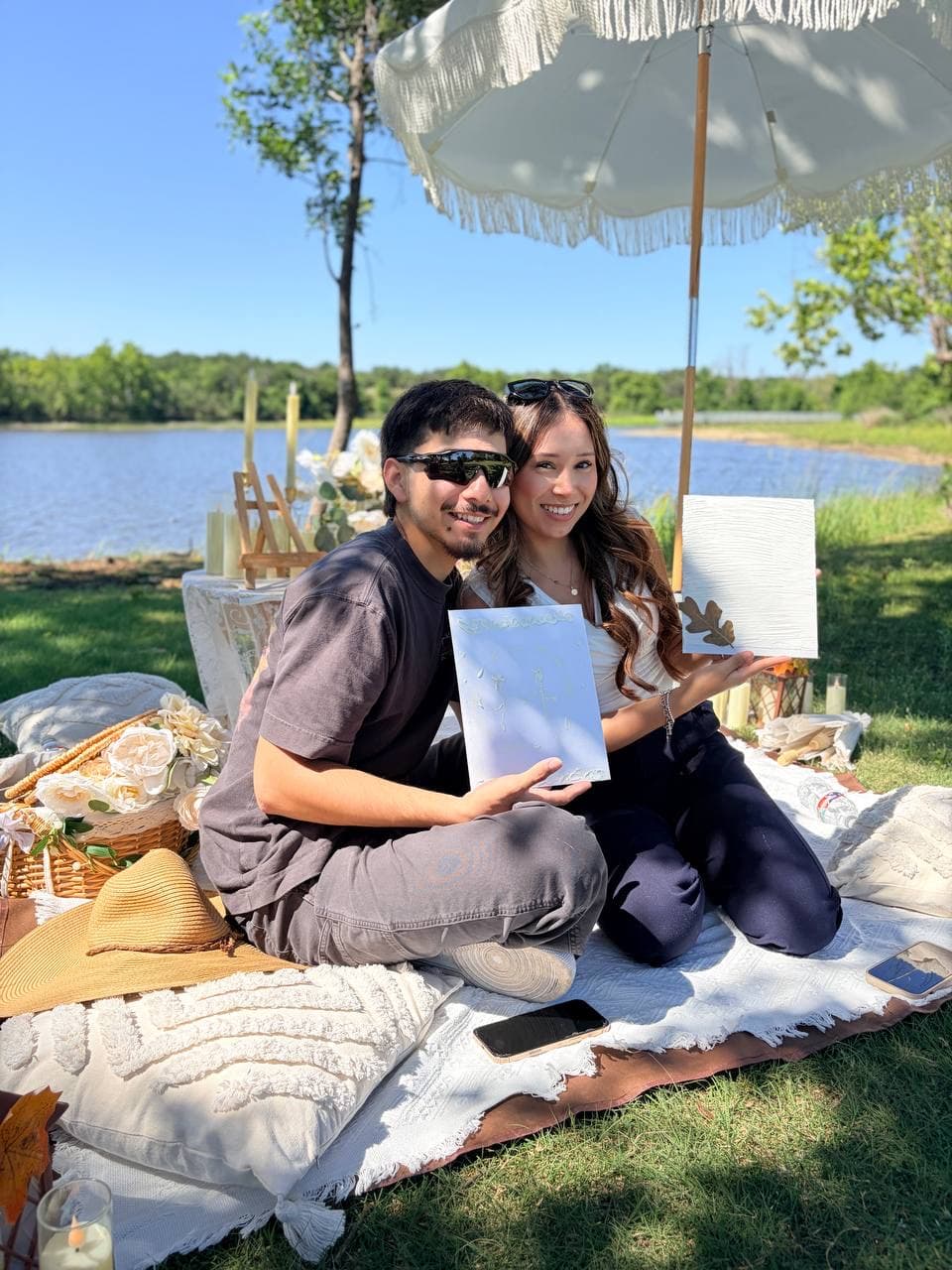 Couple celebrating at a romantic picnic by the lake Austin TX