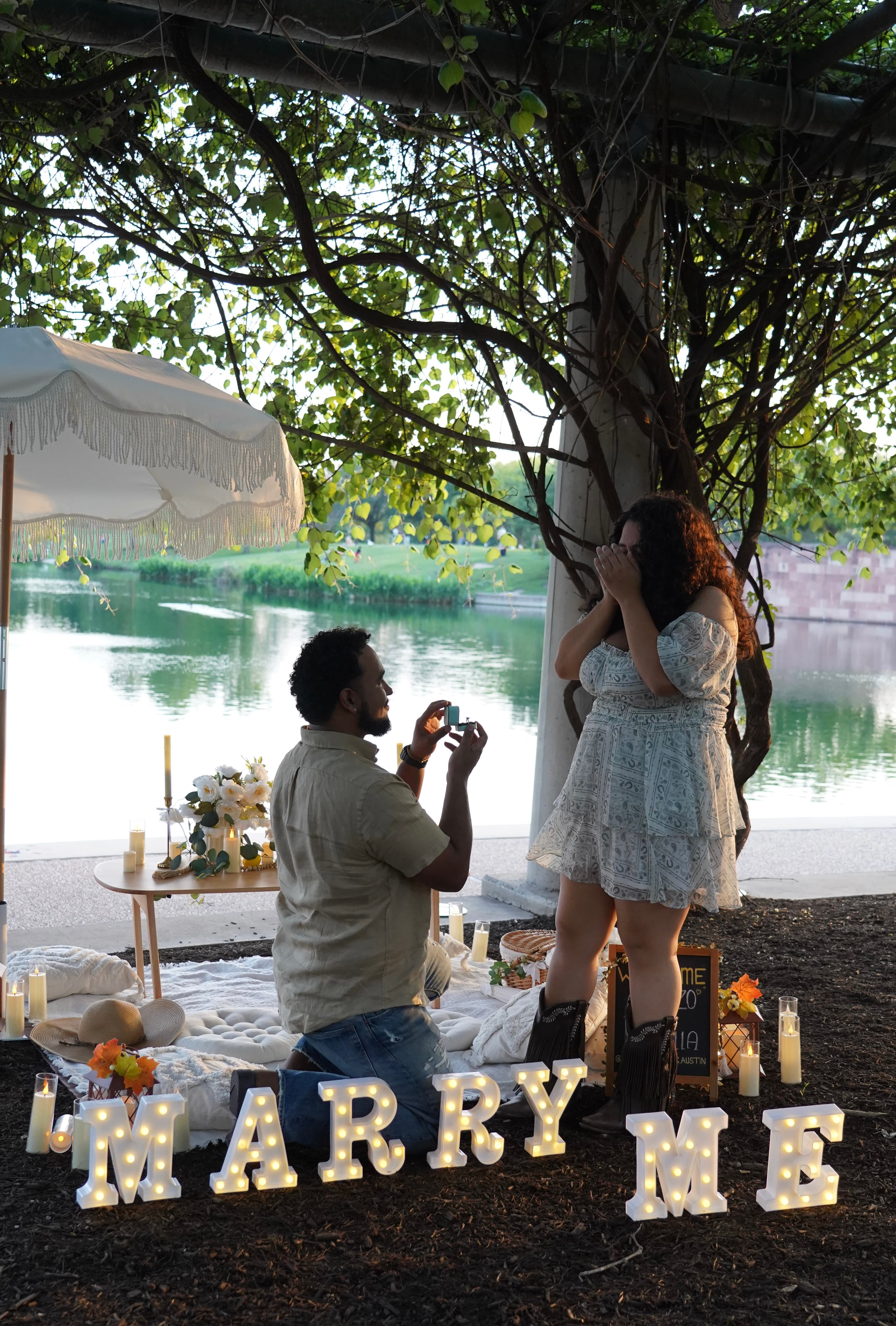 Luxury boho picnic setup with flowers and candles in Austin