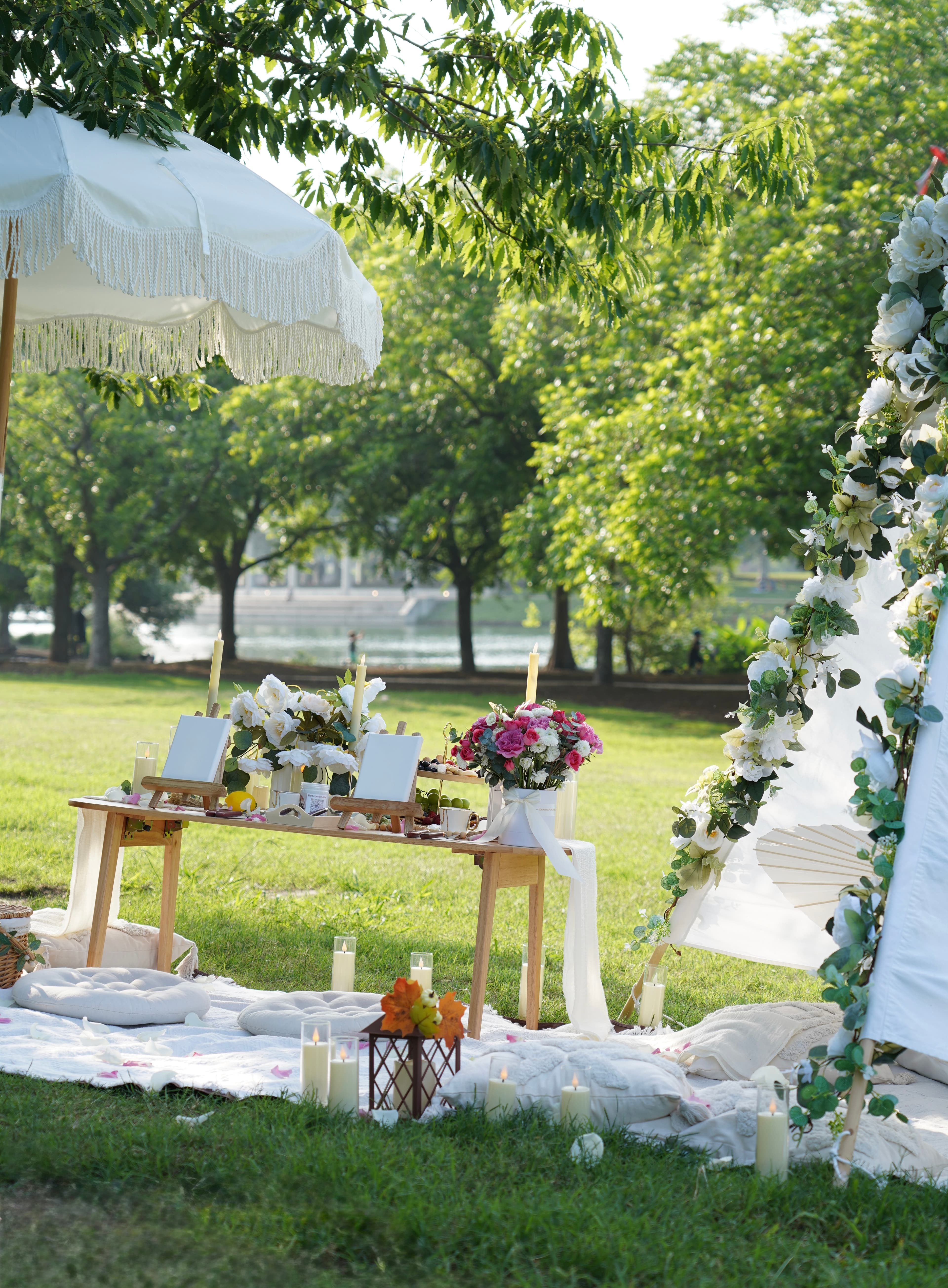 Romantic picnic setup with rose bouquet and candles Austin TX